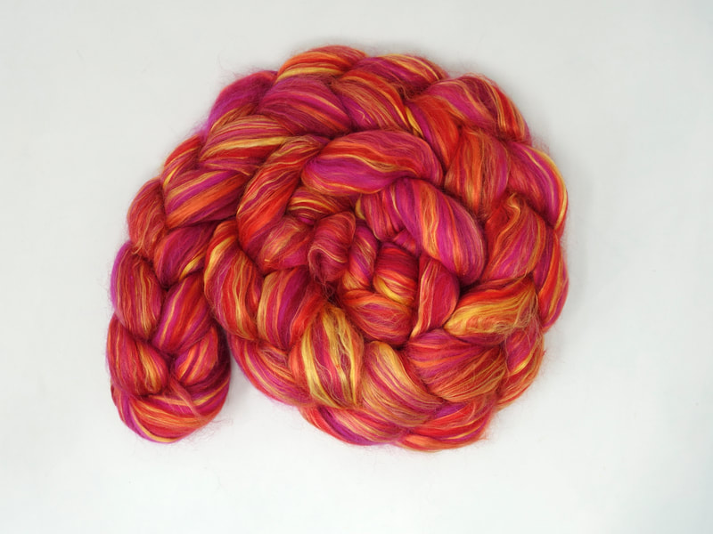 Pink spinning fibre with yellow silk streaks