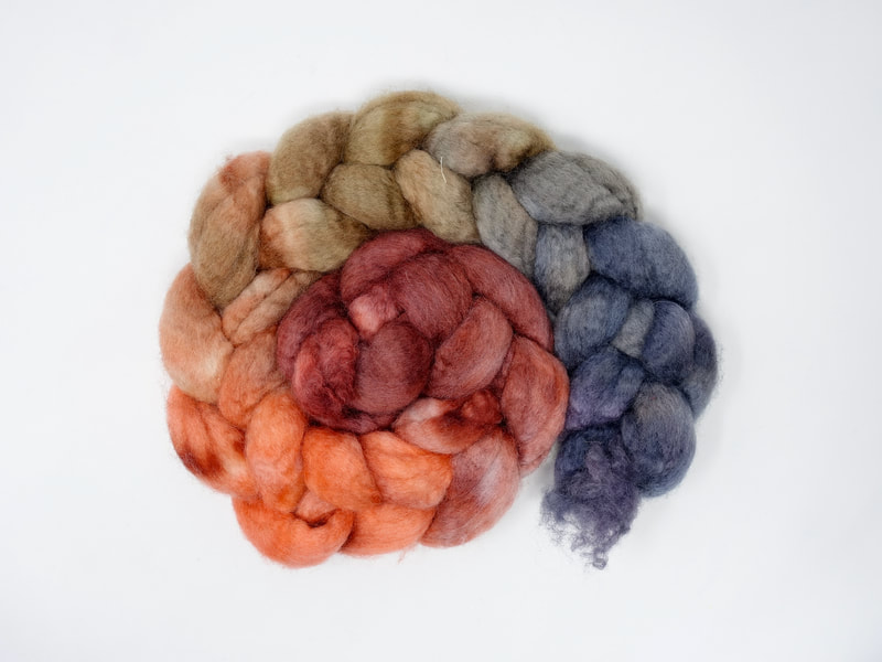Spiral of braided fibre. Colour transition- rouge, salmon, brown, grey