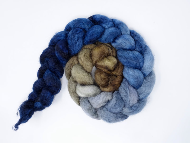 Spiral of braided fibre. Colour transition- brown, grey, cornflower, navy