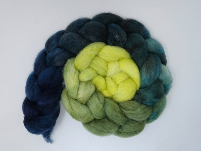 Spiral of braided fibre. Colour transition- lemon, green, teal, petrol