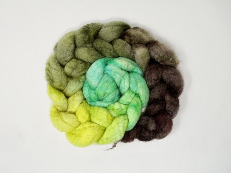 A gradient braid of fibre that transitions from mint green, to lemon yellow, to khaki to brown.  