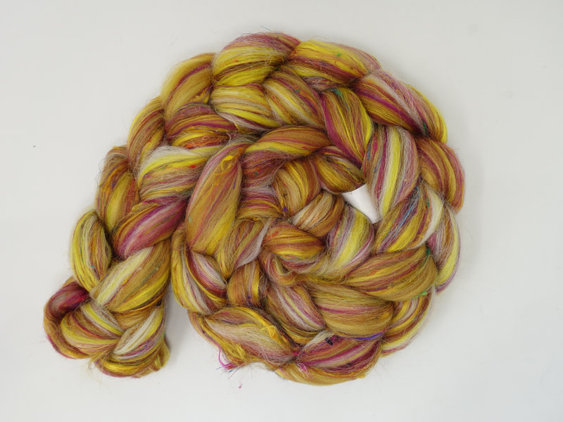 Yellow fibre with streaks of red and white