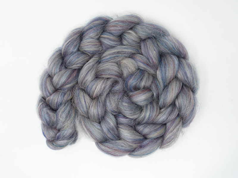 Grey-Blue fibre with faint streaks of red-purple